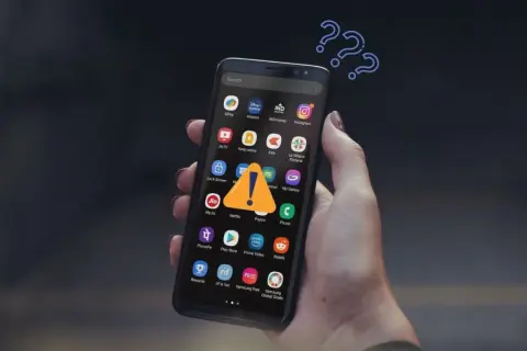 Zastanawiasz się, jak pobierać płatne aplikacje za darmo na Androida? Na ekranie telefonu widnieje ostrzeżenie, a nad nim znaki zapytania.