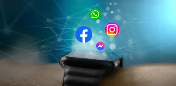 Ikony Facebook, Instagram, WhatsApp i Messenger unoszą się nad nowoczesnym smartwatchem, sugerując, jak dodać aplikacje do smartwatcha.